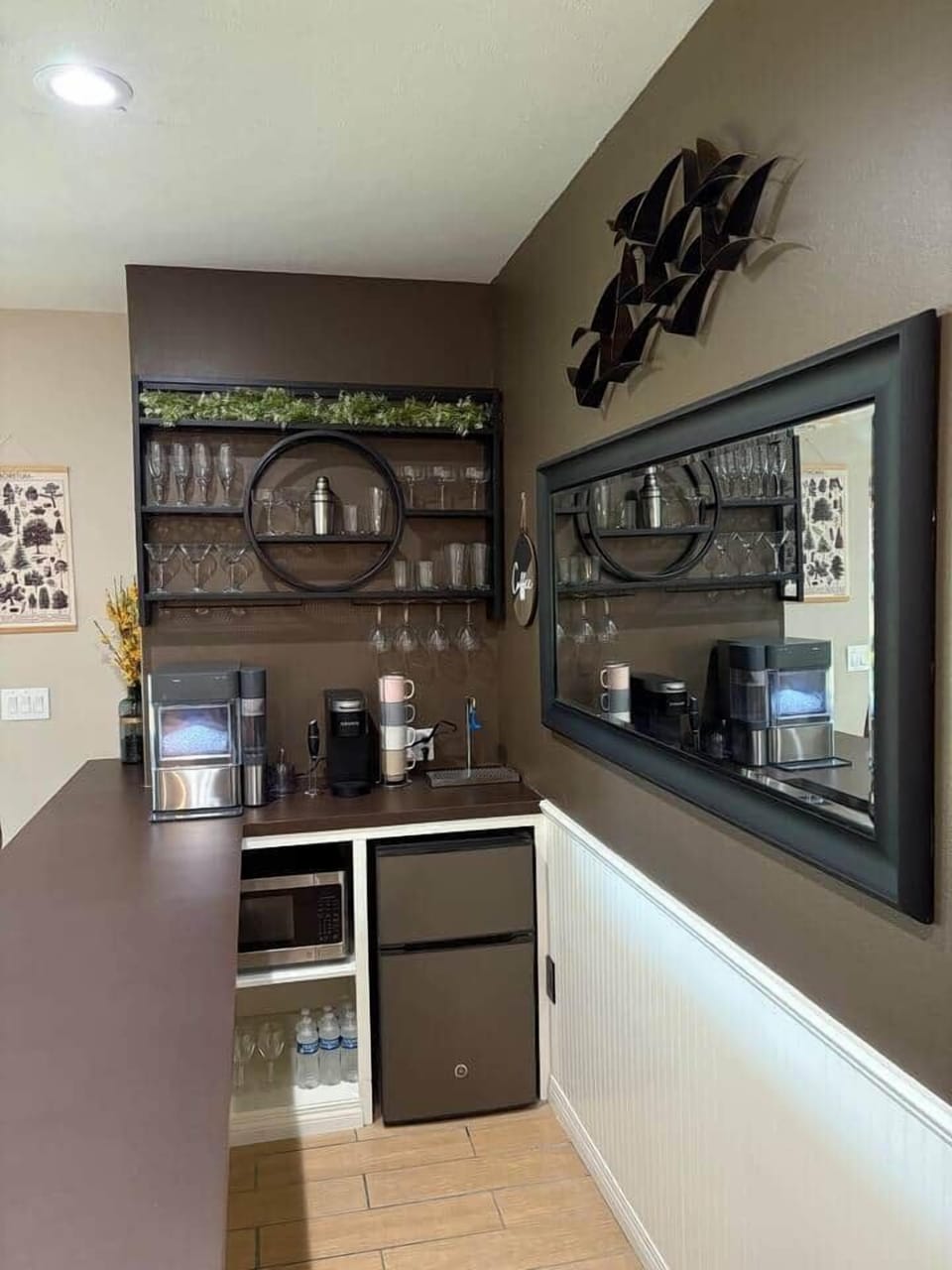 Enjoy our bar with a GE Profile nugget ice maker, Keurig coffee maker, frother, water fountain, microwave, and a variety of bar glasses, and a mini fridge stocked with mixers - free for you to enjoy during your stay!