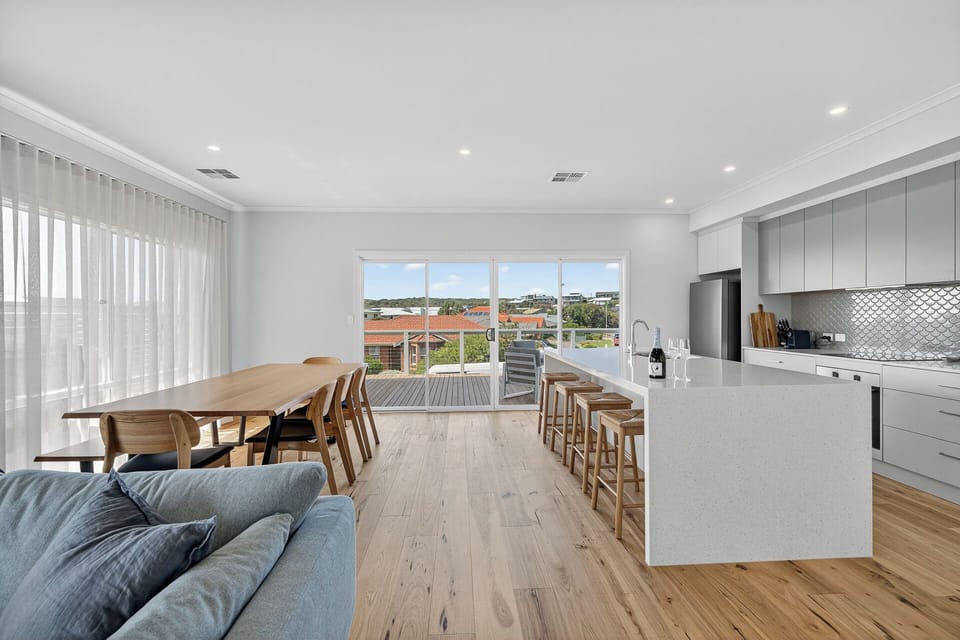 Open plan living, dining and kitchen upstairs