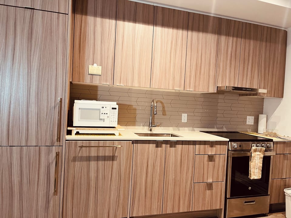 Modern all-in-one kitchen with everything  for seamless cooking experience.