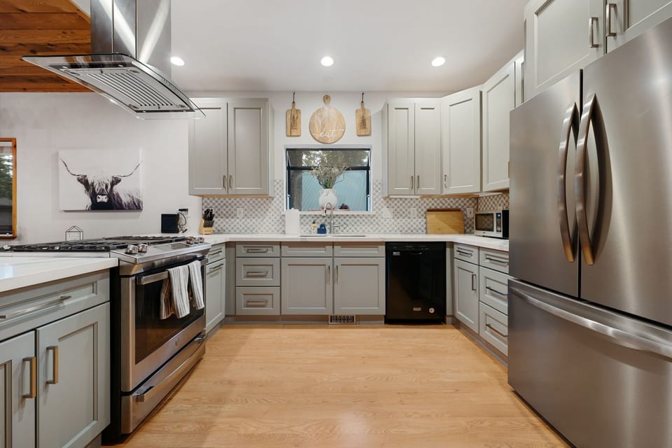 The newly remodeled kitchen offers a gas range with griddle intert and a Keurig