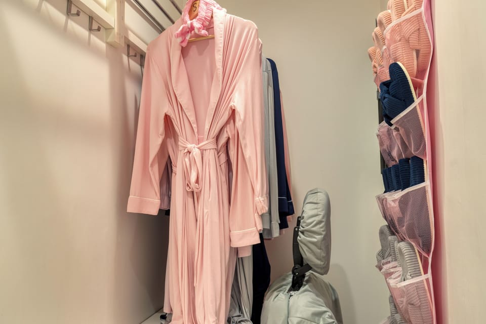 Soft robes and cozy extras tucked neatly in the closet, ready for a comfortable stay.