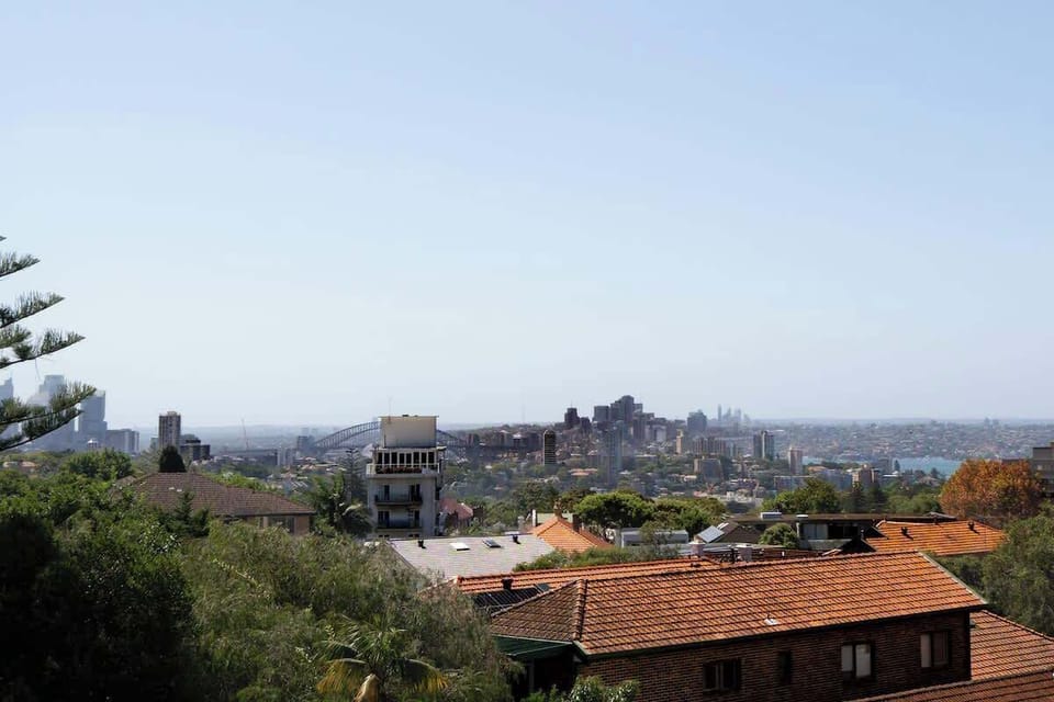 Day-time view of the city and harbour bridge from the main living area balcony