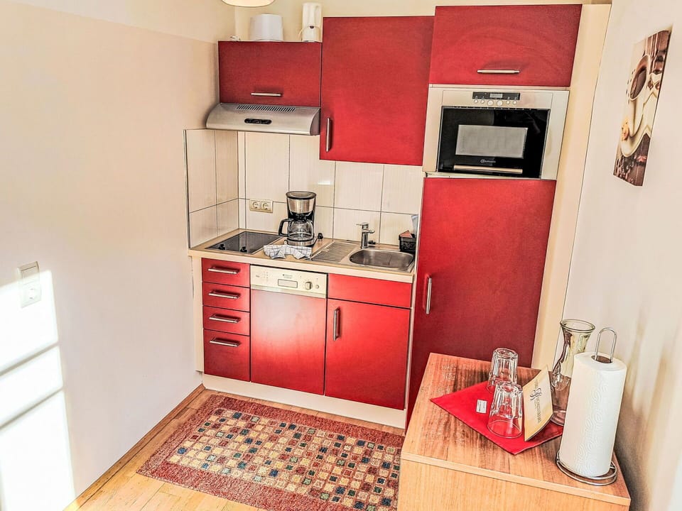Floor, Furniture, Interior Design, Flooring, Major Appliance, Room, Kitchen Appliance, Apartment, Kitchen, Cabinetry