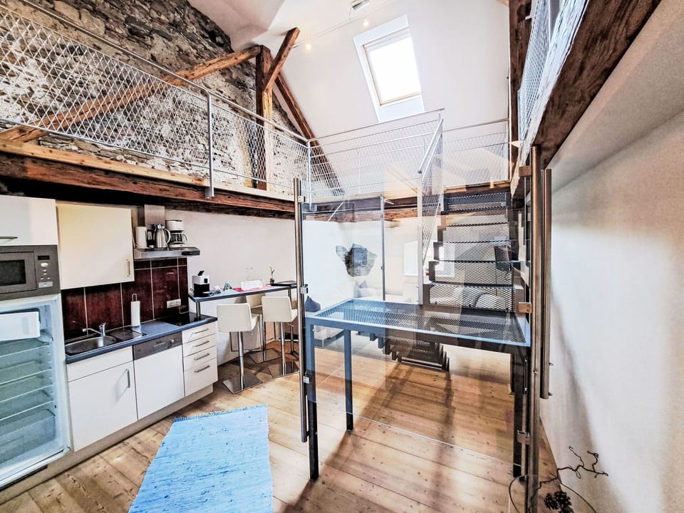 Flooring, Interior Design, Ceiling, Floor, Lighting, Apartment, Wood Flooring, Chair, Loft, Hardwood