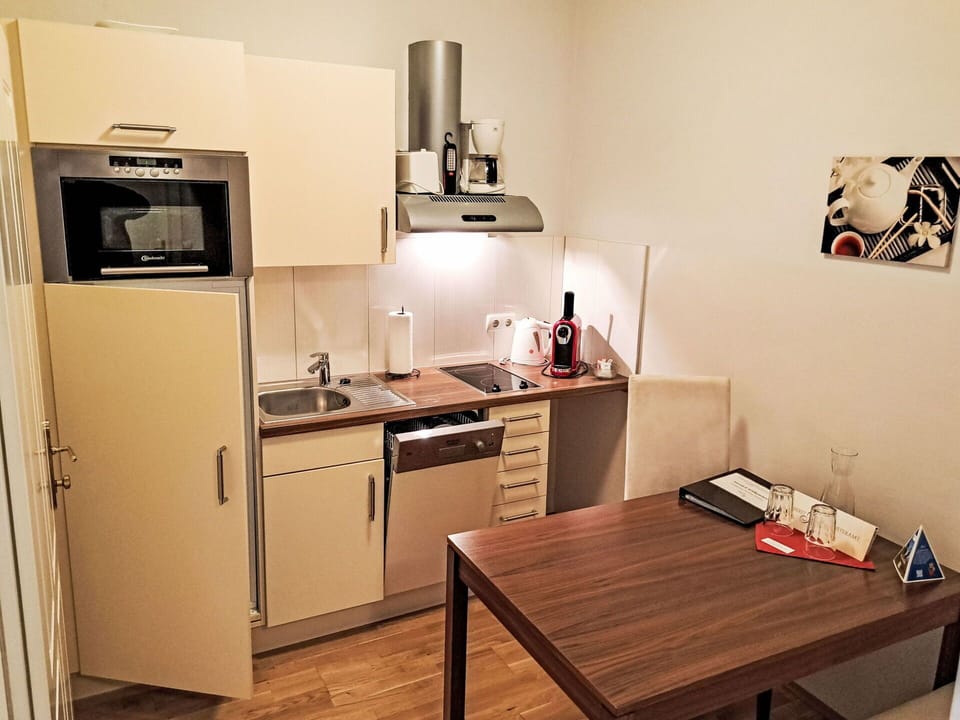 Furniture, Wood, Kitchen Appliance, Interior Design, Major Appliance, Flooring, Kitchen, Floor, Countertop, Cabinetry