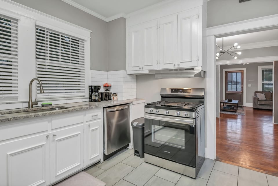 Bright updated kitchen with stainless appliances and open flow