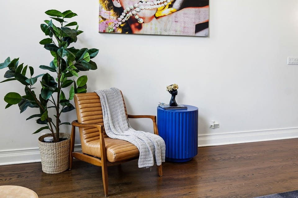 Cozy lounge corner w/ seating and screens, great for casual downtime together.