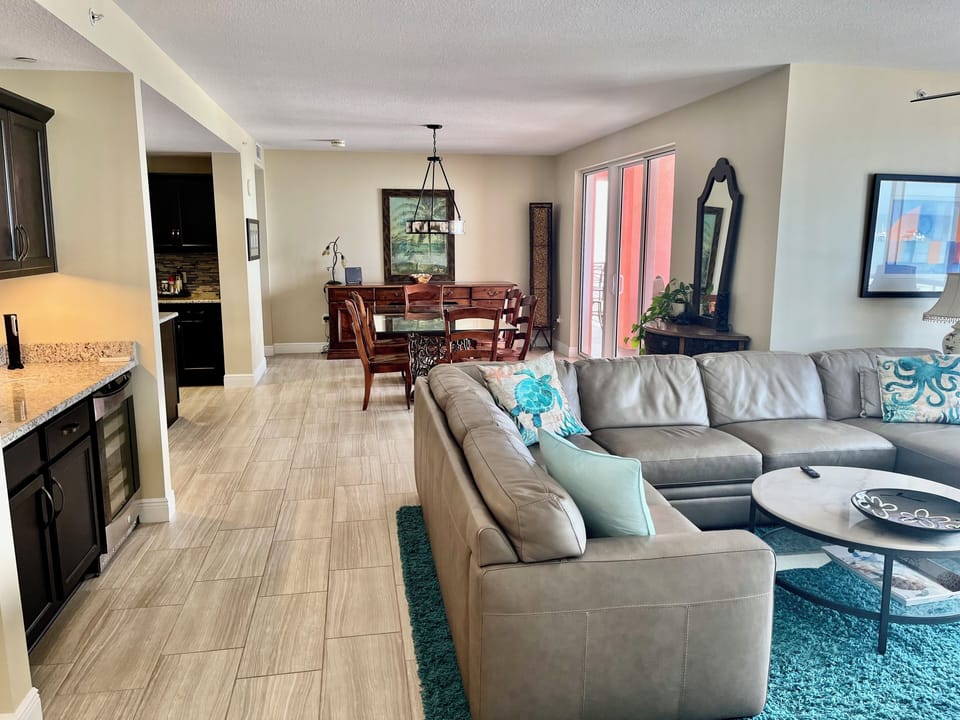 Great room plenty of seating 75 TV 30 ft of Glass facing the Beach