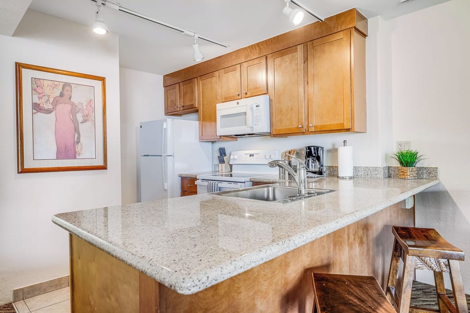 Lots of counter space for cooking and bar stools to pull up for a snack!