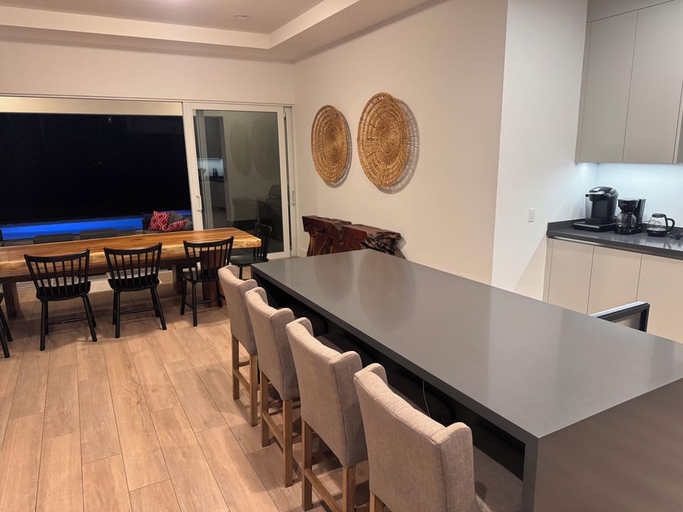 The kitchen island seats five and has a wine fridge underneath