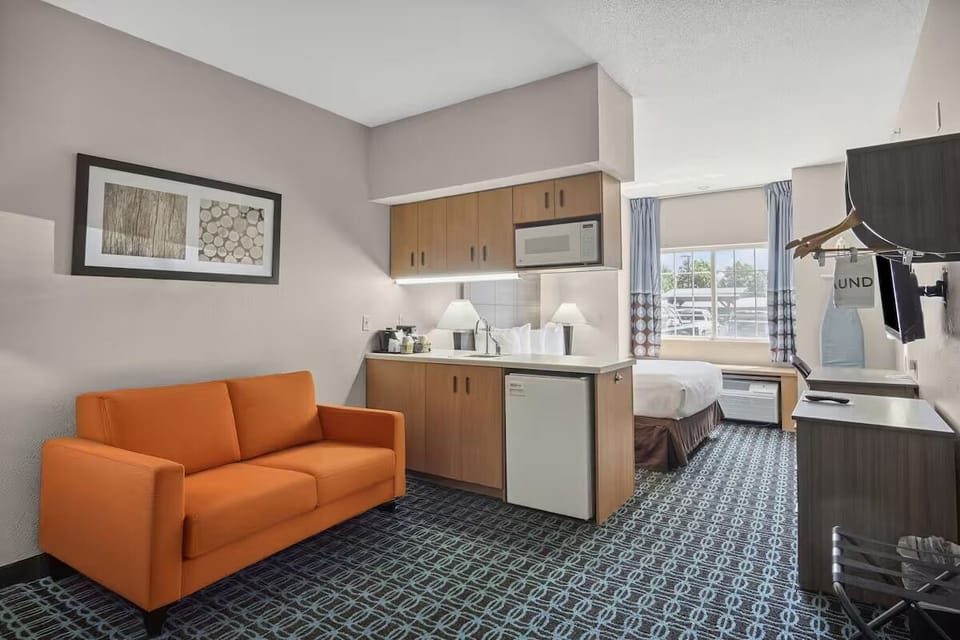 Stretch out in a cozy suite with sofa and kitchenette.