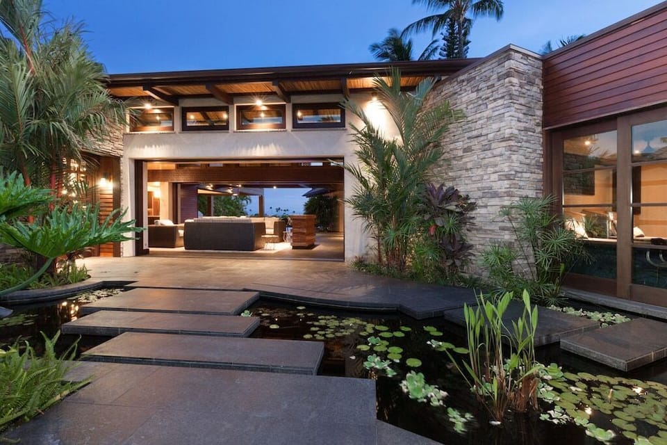 Pathway over koi pond to main house