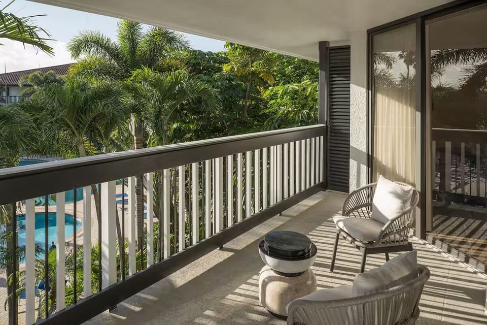 Breathe in warm breezes from your private balcony seating nook.