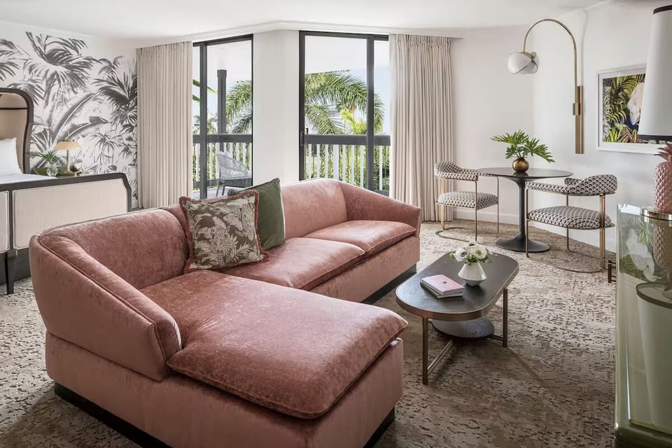 Unwind in a bright suite with lounge seating and views.