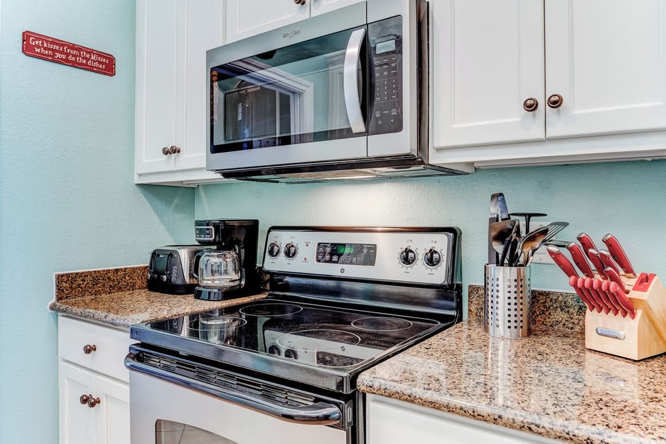 Modern stainless microwave and range.