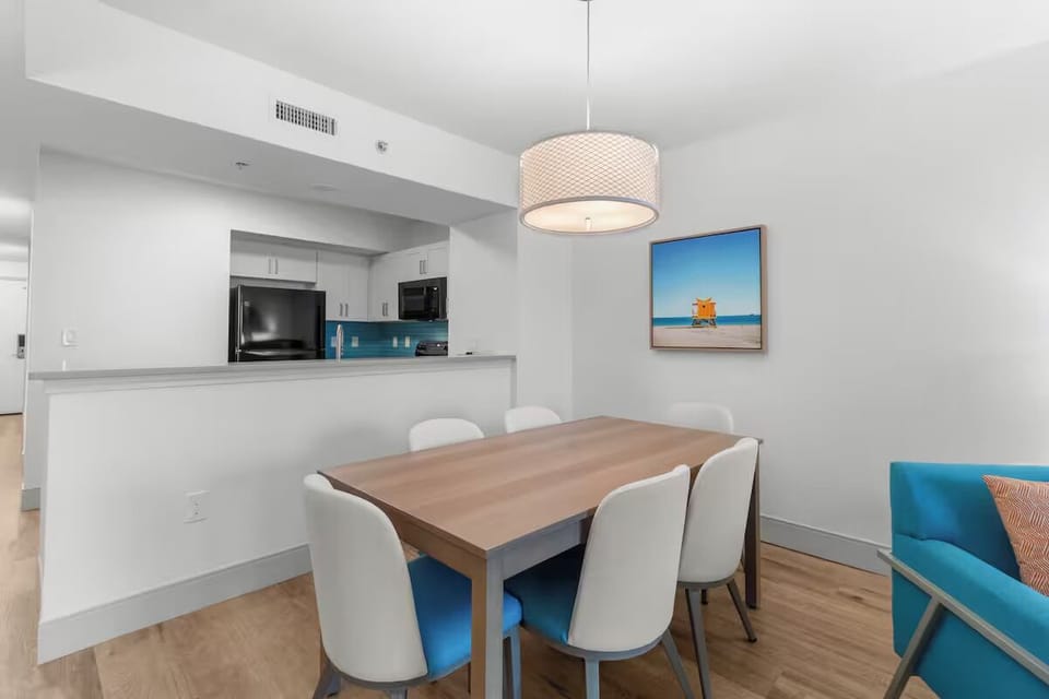 Serve easy dinners with open sightlines to the kitchen pass-through.