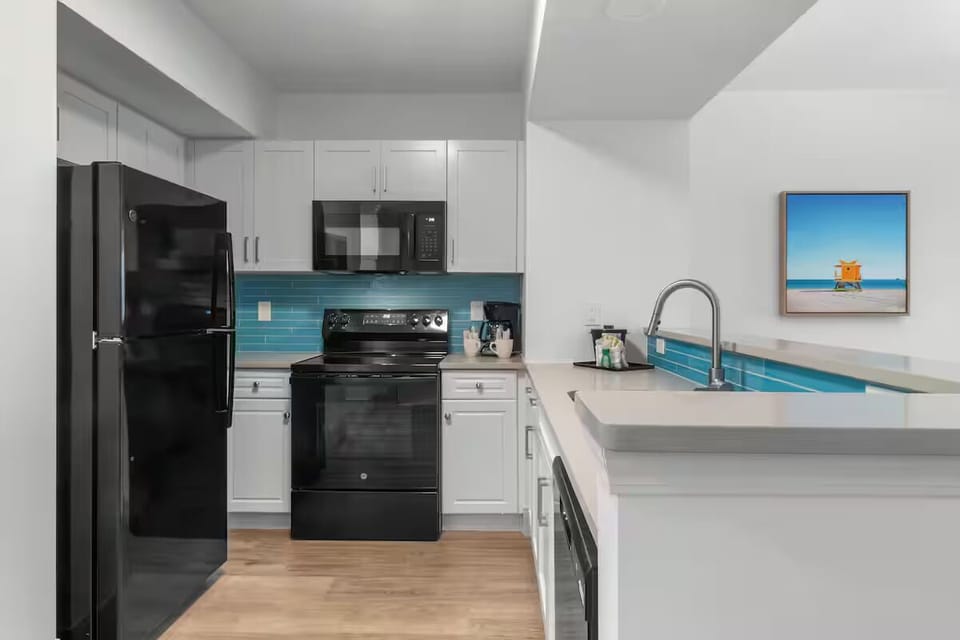 Cook vacation favorites in a bright, beachy full kitchen.