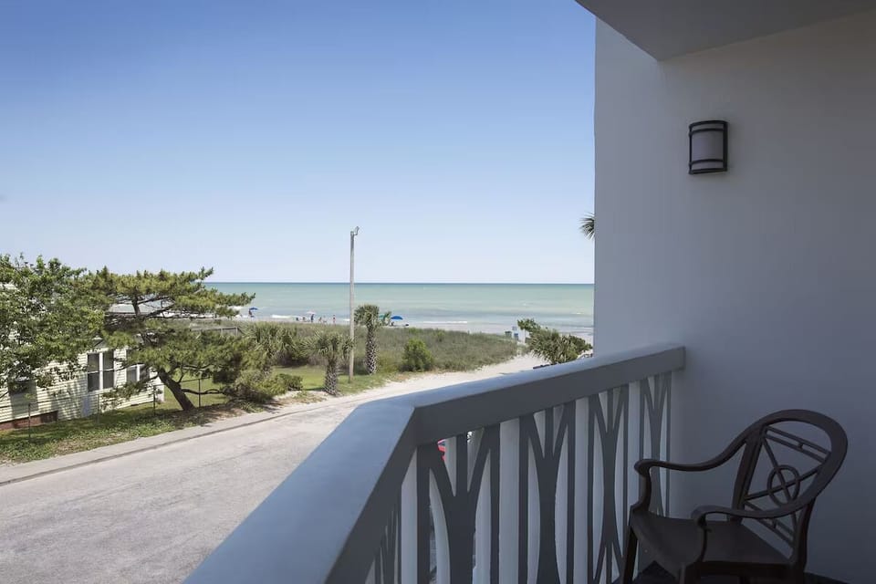 Sip morning coffee on your balcony with coastal breezes.
