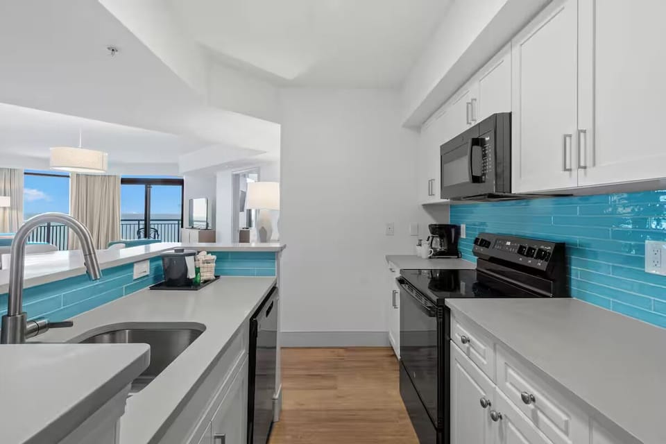 Prep beach snacks with a double sink and open sightlines.