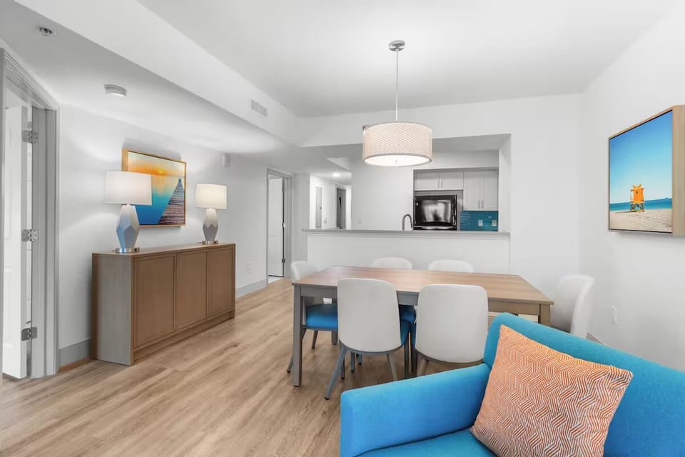 Share meals together at the spacious dining table under soft light.