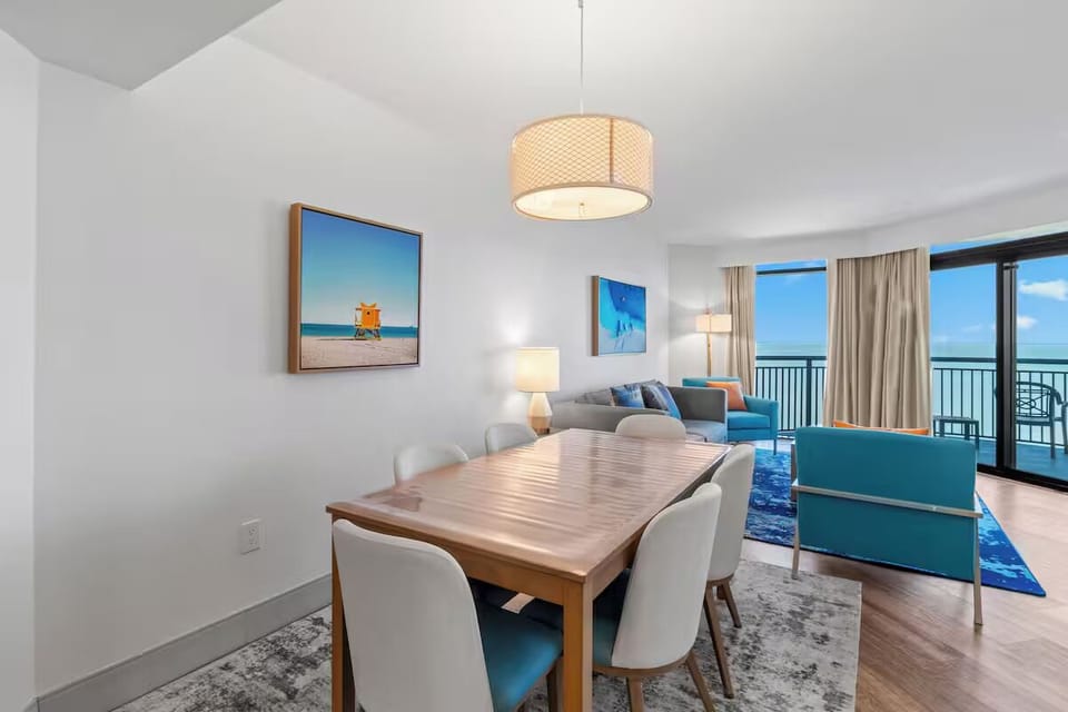 Gather for meals while the ocean glows in view.