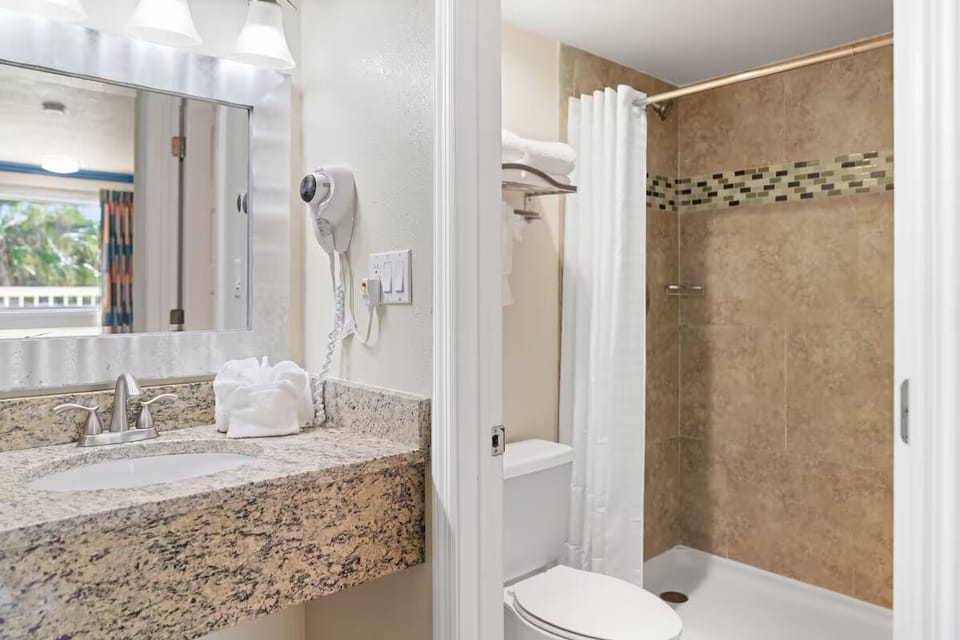 Refresh fast with a bright vanity and tiled shower.