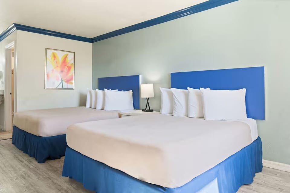 Unwind together in a spacious room with double beds.