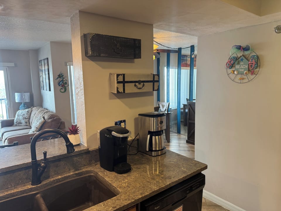 Well-equipped kitchen with coffee makers and other small appliances