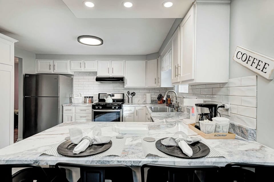 Gemini said
This photo showcases the gourmet kitchen's high-end features, including a professional gas range and sleek countertops. 