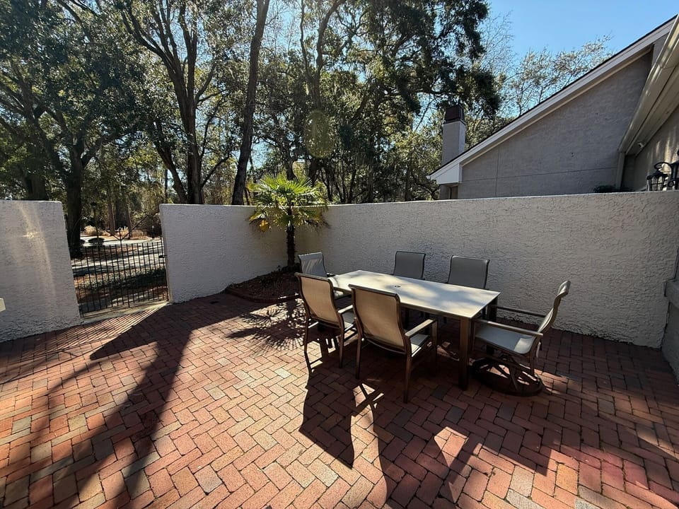 backyard patio with table with 6 chairs