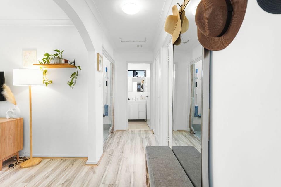 Bright hallway connecting bedrooms and living spaces