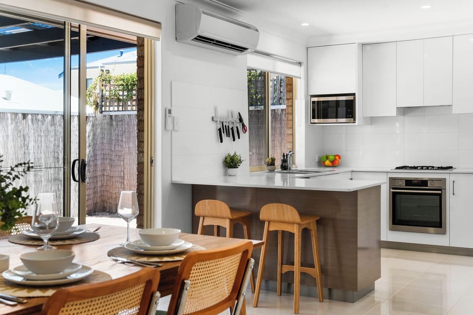 Modern kitchen with breakfast bar seating.