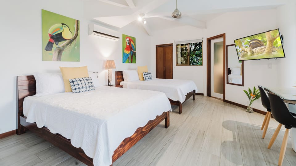 Bedroom with two queen beds and TV