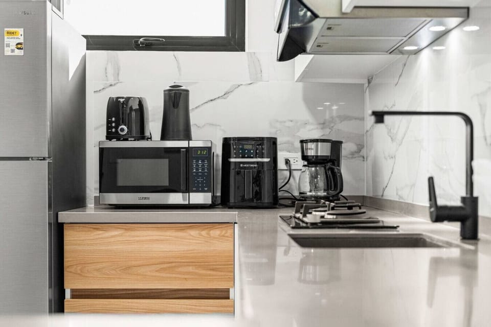 Kitchen space perfect for quick meals and morning coffee