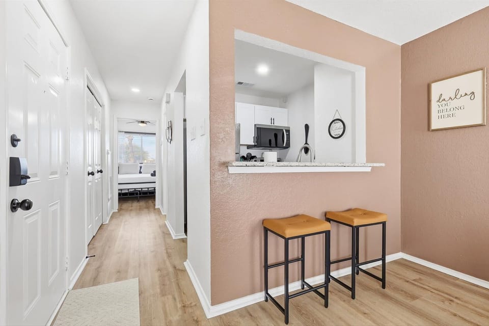 With the best of function and design in mind, this kitchen pass-through also doubles as a breakfast bar with high-top stool seating.