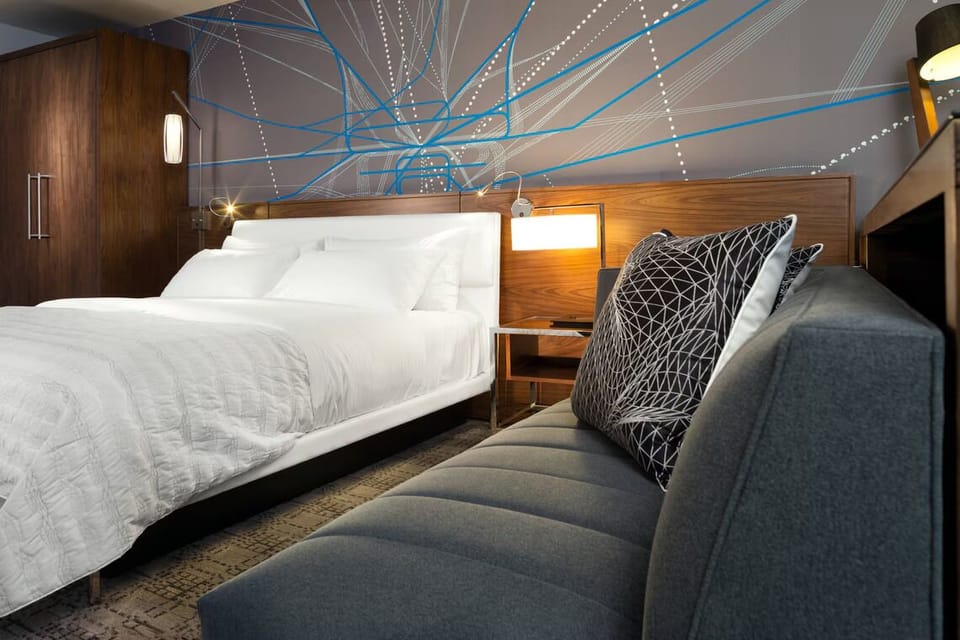 Stretch out on the sofa beside a plush, inviting bed.