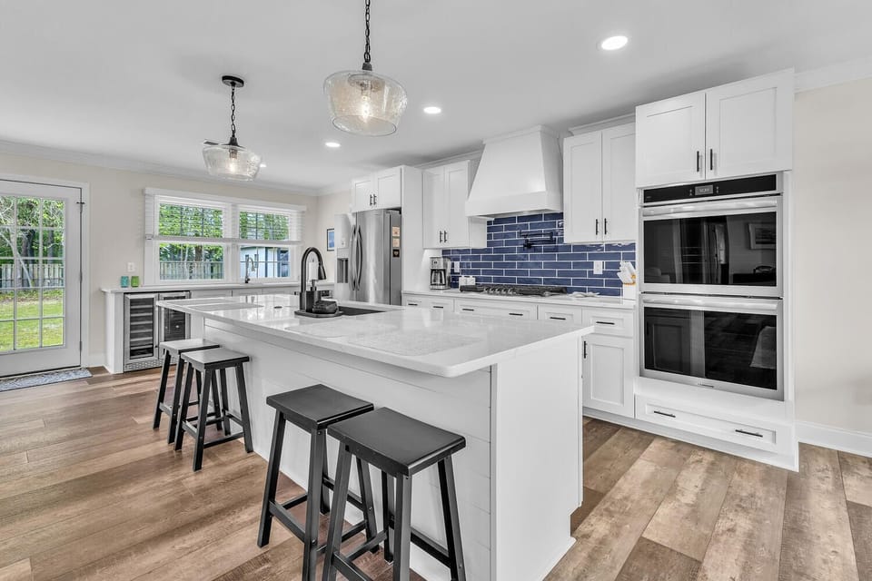 Crisp white cabinetry and sleek countertops.