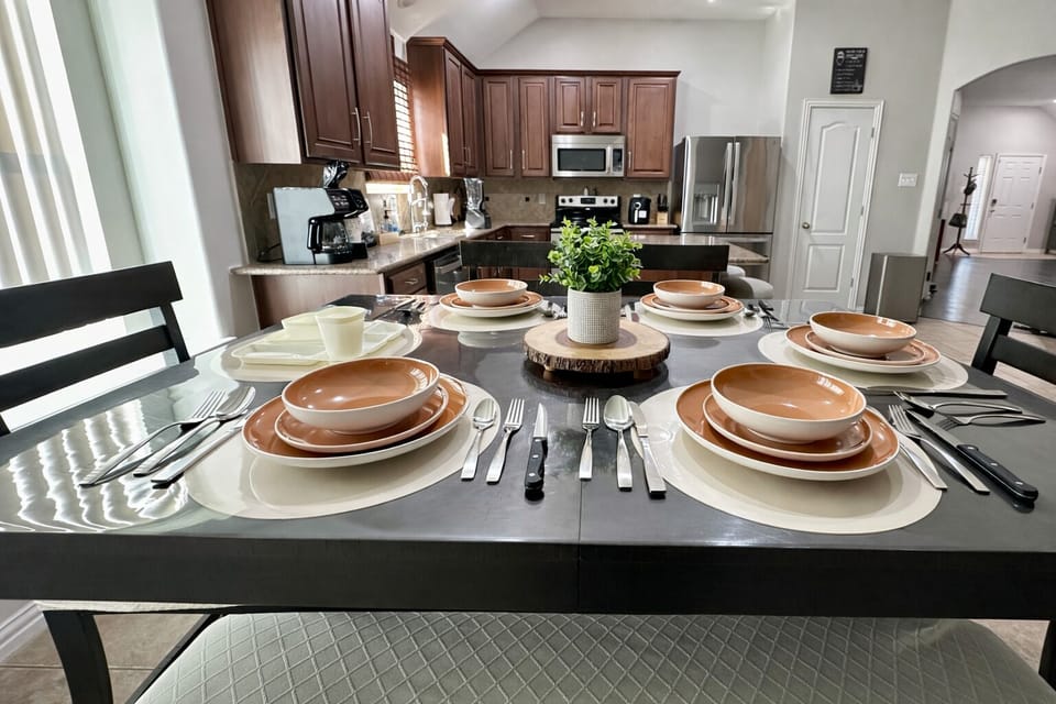 Dining table with seating for six plus kitchen island seating for two.