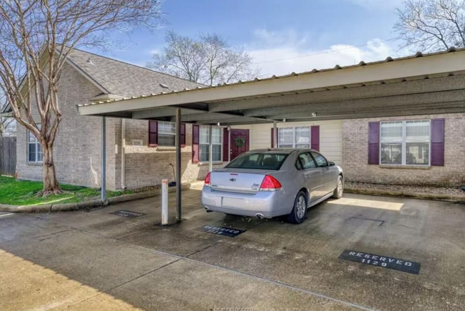 3 covered parking spaces plus one visitor space