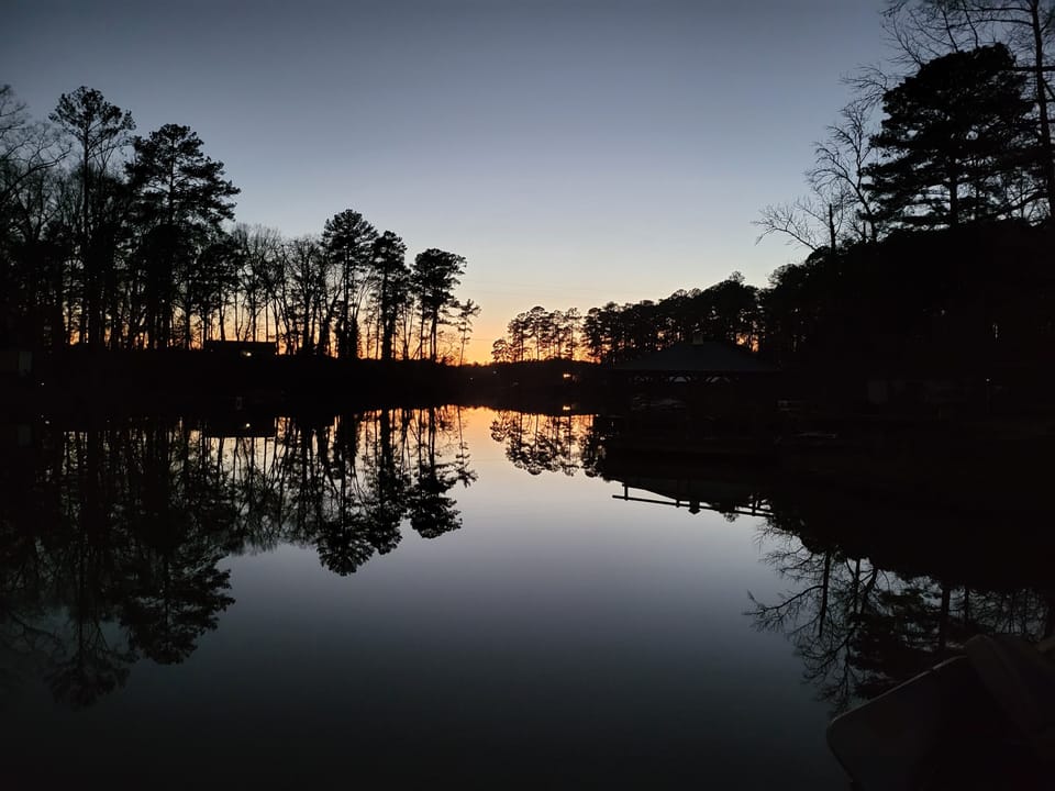 Watching the sunset in our cove from our dock.