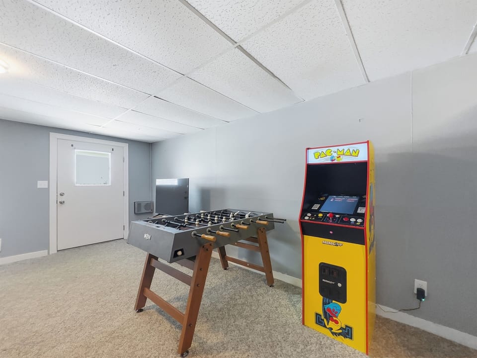Foosball, Smart TV, and Arcade. Ground-level walkout to the park and Rangeley Lake.