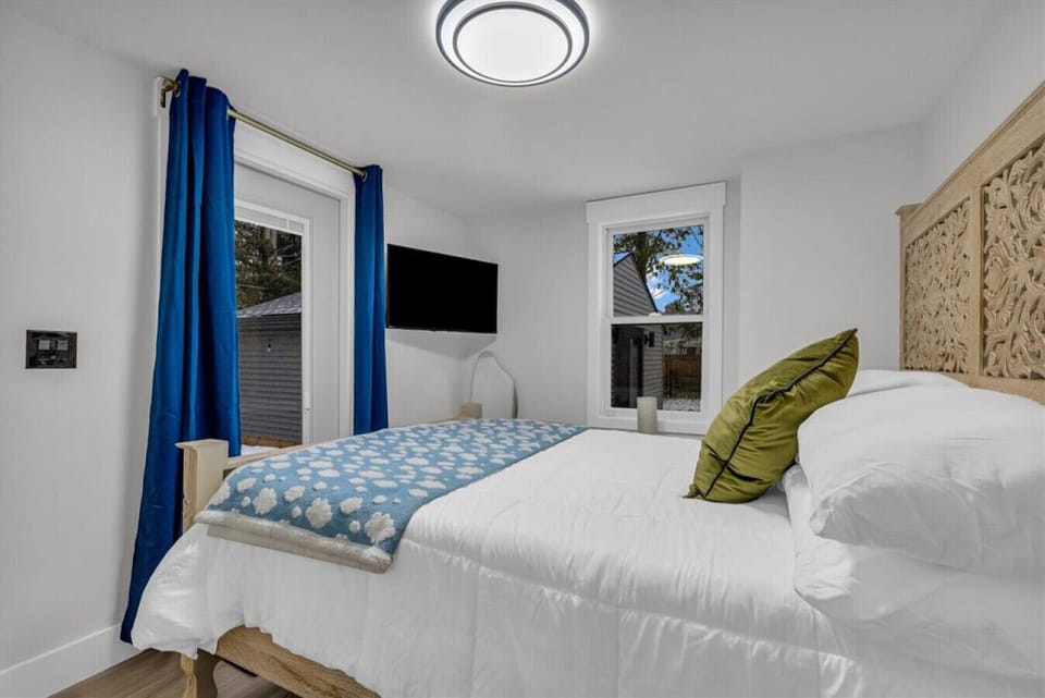 Bright, crisp, and stylish. Blue curtains with a pop of green to keep things fresh.