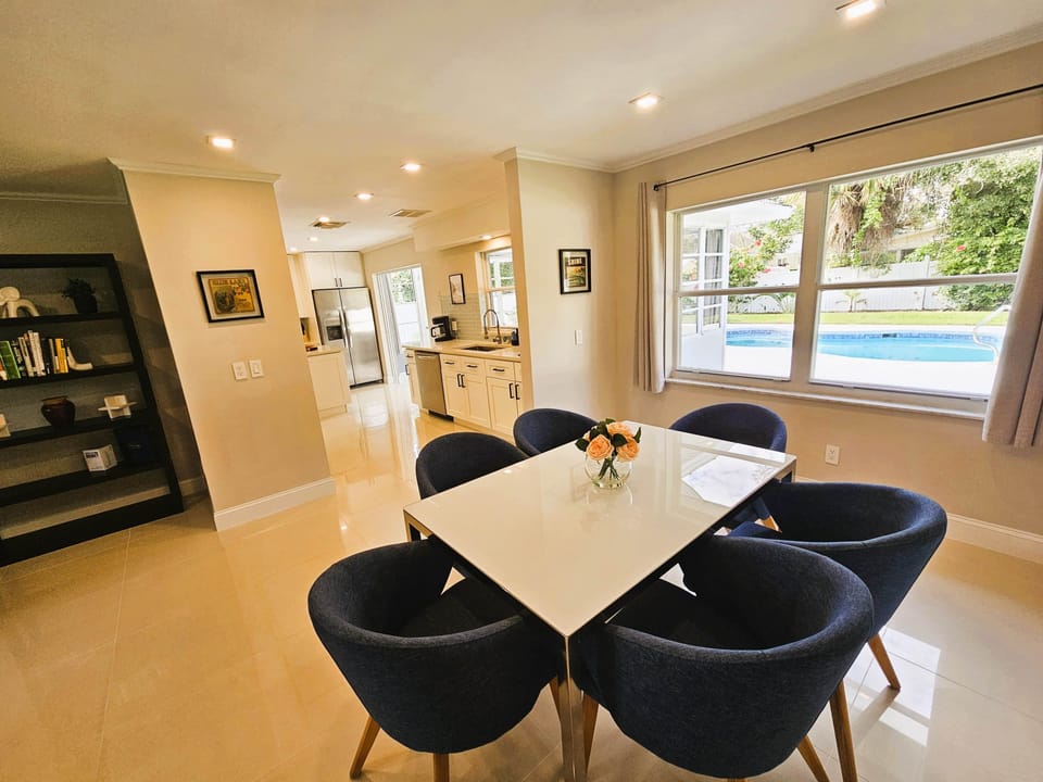Dining Table with Views of the Backyard and Pool