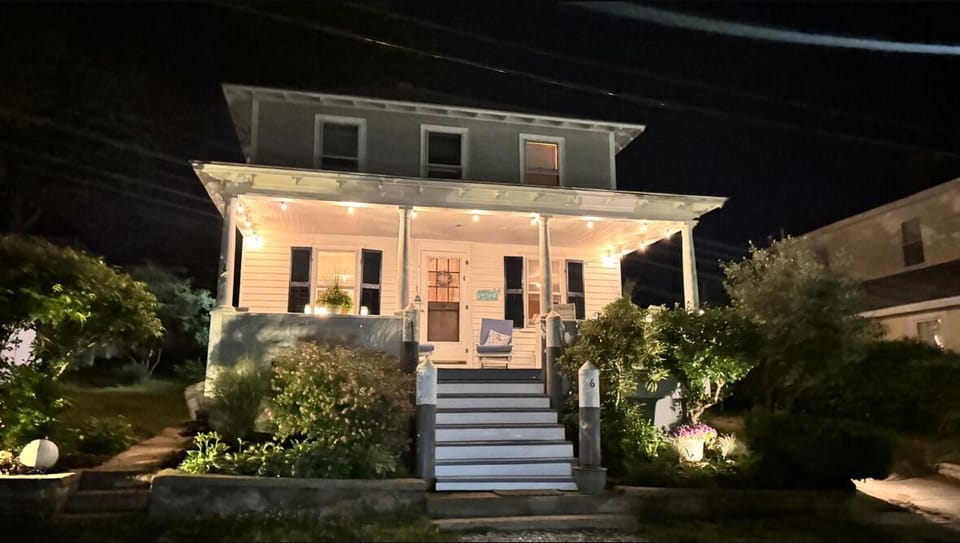 New roof, cedar shakers, privacy fence, porch, cushions, lights, roses. love