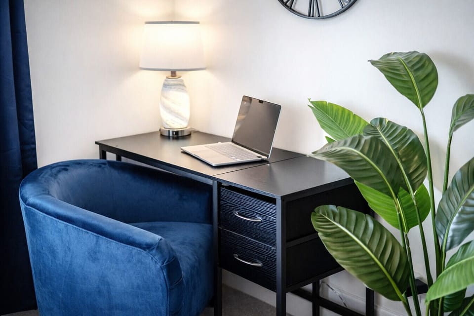 Relax in the spacious living room or catch up on work at the dedicated workspace.