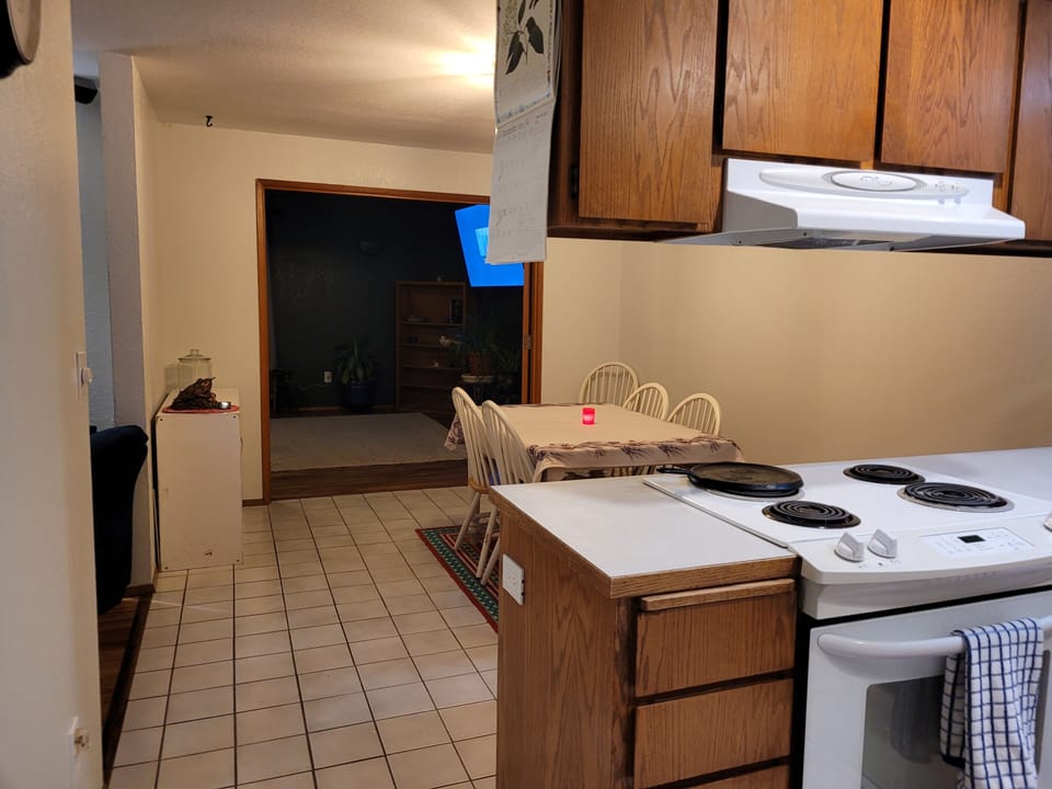 Kitchen looking into dining room and family room