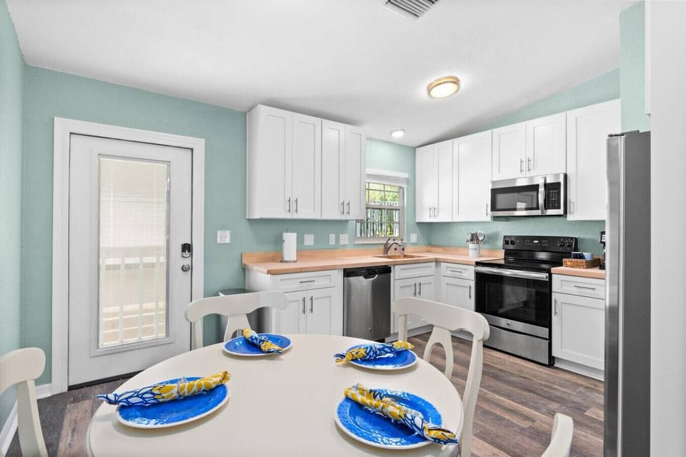 Kitchen | Bright & airy renovated kitchen complete with butcher block countertops!