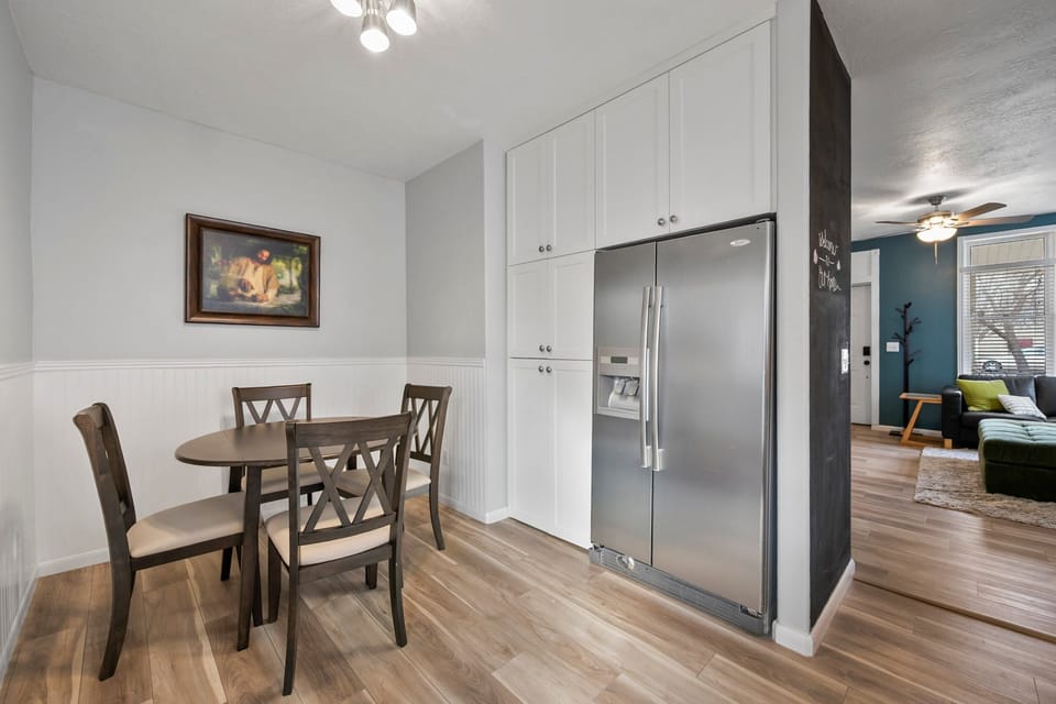 A compact and cute dining area just off the kitchen with exit to back yard area.