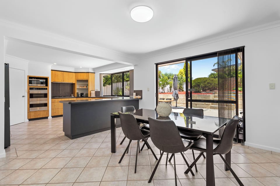 Open plan living area connecting the kitchen, informal dining and living rooms.