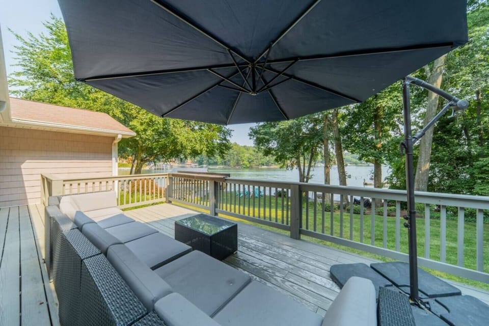 Outdoor Oasis: Gather around the fire pit with stunning lake views and Adirondack seating
